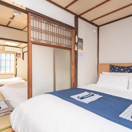 Guesthouse Oneworld Shijo四条京町屋 Кіото Екстер'єр фото